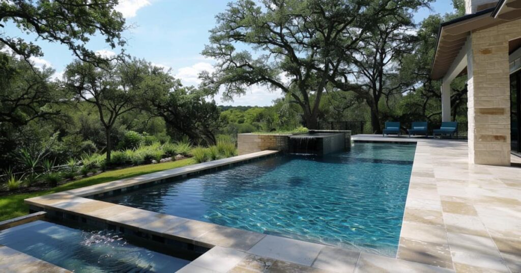 rectangular pool overlooking grass and tree landscape